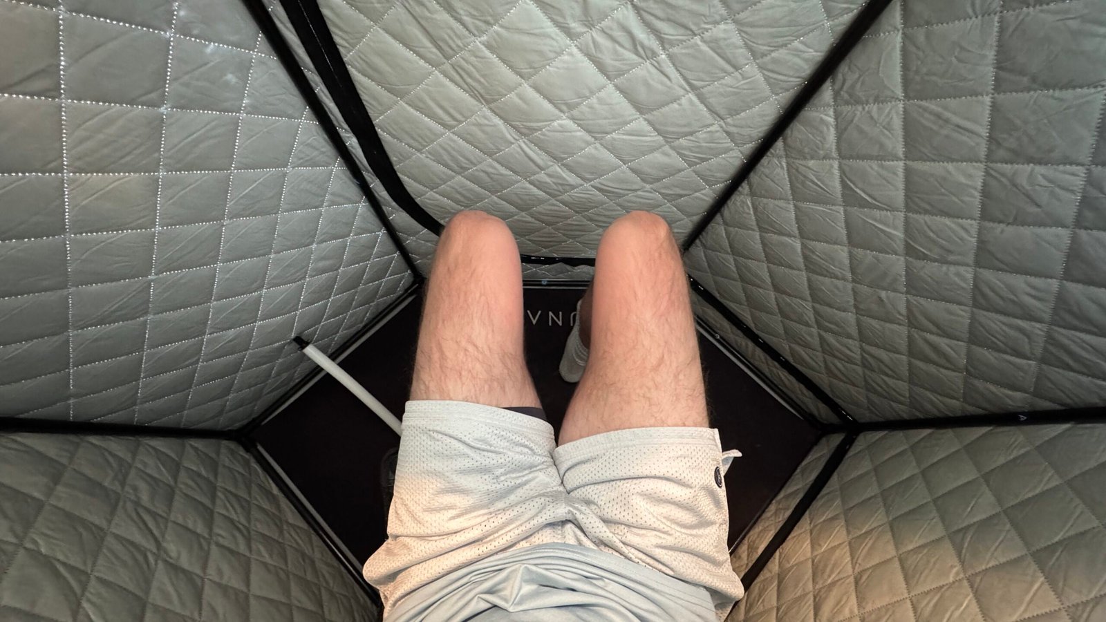 Bennett Carby showing how not to sit in the saunabox smartsteam kit pro